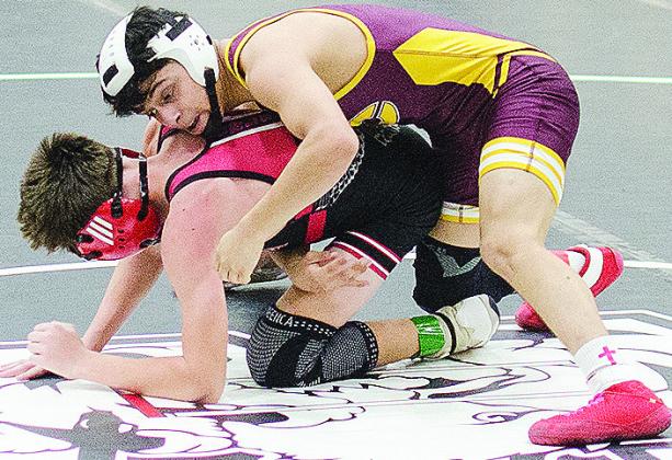 Clinton’s Matthew Bermea, top, holds his opponent to the mat during the first day of the Max Dippel Memorial Wrestling Tournament Friday in Weatherford. CDN | Sam Goodwyn