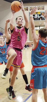 No. 5 Wesley Switzer takes to the air as he goes up against Chieftain defender for the layup during A-B’s home game against Calumet. CDN | Sam Goodwyn