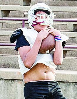 Jordan Rhoads craddles the ball as he catches it during practice. CDN | Sam Goodwyn
