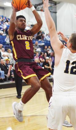 Clinton junior guard Atrel Bryson shoots a fadeaway jumper over a Kingfisher defender. Bryson recorded eight points and three assists in the loss to KF. CDN | Collin Wieder
