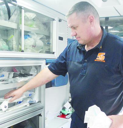 Sinor EMS Technician Jerry Rhein stocks the back of his ambulance with various sets of new medical equipment. CDN | Micah Ashcraft