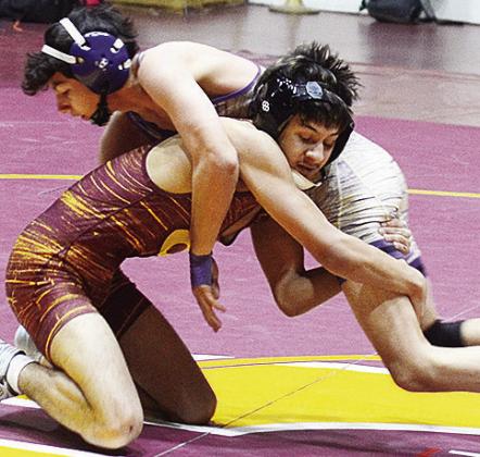 Clinton’s Brandon Rodriguez-Esclalante attempts a fireman’s carry move on his opponent from Anadarko during the Class 4A District 3 Wrestling Tournament. CDN | Sam Goodwyn