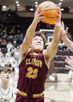 No. 23 Easten Powell grabs the rebound during Clinton’s comeback road win Tuesday over Elk City. CDN | Sam Goodwyn
