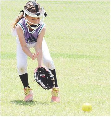 Morrison’s Adalynn Cotton charges at the ground ball during the Magic’s game against the Mooreland Wildcats Thursday in the OK Kids 8U State Softball Tournament at Schumacher Fields at Acme Brick Park. CDN | Sam Goodwyn