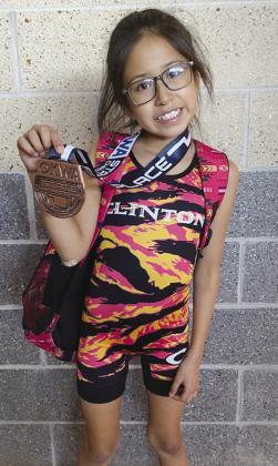 Geneieve Goodblanket shows off her eighth-place medal after wrestling in the 57-pound weight class of the 10U bracket in the OKWA State Wrestling Tournament. CDN |Courtesy Photo