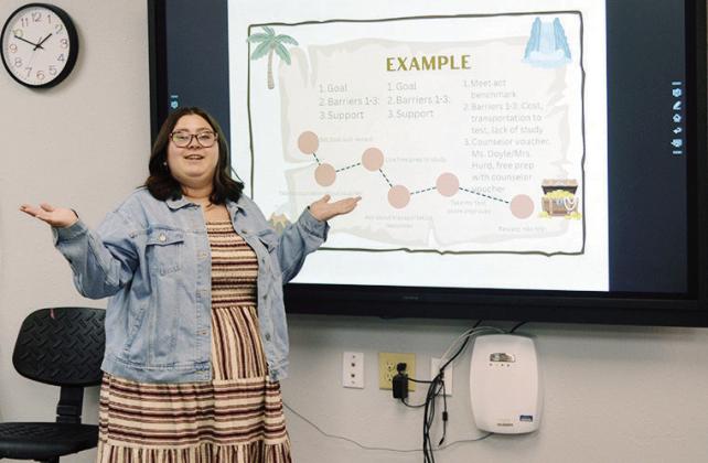 Kaylei Doyle explains the treasure map activity recently at the JAG (Jobs for America’s Graduates) classroom in CHS. The activity has students fill out a goal they wish to accomplish and plot points to work toward achieving that goal. CDN | Christian Jacobsen