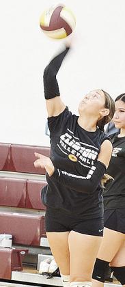 Aliyah Lopez smacks the ball back over the net during a recent practice. CDN | Sam Goodwyn