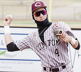 Clinton’s Declan Brown throws the ball back to the pitcher in the Reds’ game against Kingfisher. CDN | Sam Goodwyn