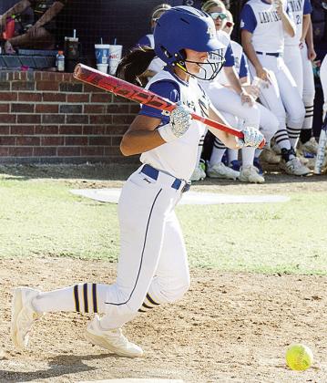 Madi Lockhart bunts the ball for a hit during A-B’s home game against L-S. CDN | Sam Goodwyn