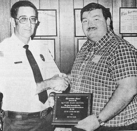 40 YEARS AGO Baptist burn center registered nurse Mac McClendon, right, was presented a plaque by the Clinton Fire Department in appreciation of the care given by the Oklahoma City center to fireman Robert Poore after he was injured in a fire accident in