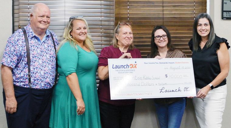 LaunchOK, the STEM and aerospace education fund, awarded Clinton Public Schools with a $10,000 check. Pictured from left are CHS science teachers Joe Hayes, Whitney Misak, and Lori Gwyn; Senior Manager of Strategic Outreach for LaunchOK Valerie Philips; and CHS Principal Michelle Sorter. CDN | Christian Jacobsen