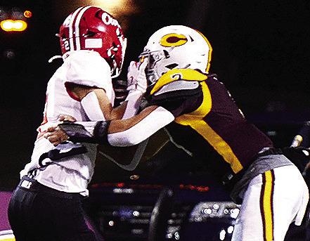 Clinton’s No. 7 Easten Powell wraps up the Elgin runner during the Red Tornadoes’ home game against the Owls. CDN | Micah Ashcraft