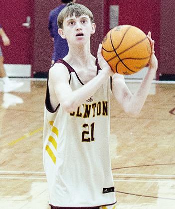 Freshman Wyatt Robnett focuses on the hoop as he prepares to shoot the ball during warm-ups prior to the game against Anadarko. CDN |Sam Goodwyn