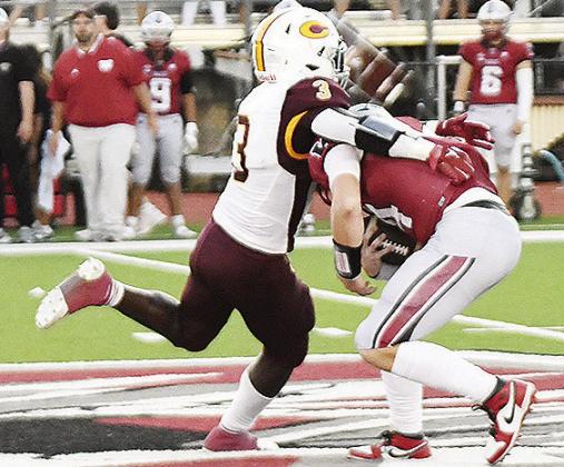 No. 3 Zaedon Collins tackles the Eagles’ ball carrier during the “Custer County Conflict” in Weatherford. CDN | John Kinsey