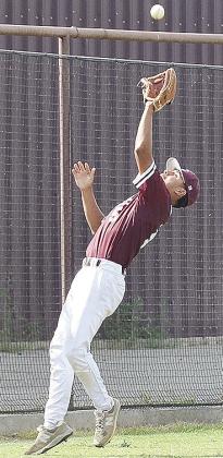 No. 5 Jesus Gutierrez stretches out to catch the ball during Clinton’s home game Tuesday against Canute. CDN | Sam Goodwyn