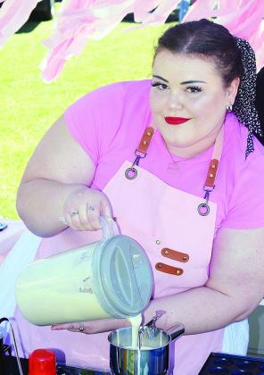 Ashley Gubitz with Lil Manasitas Mini Pancakes pours batter at Saturday’s Cinco de Mayo Festival. CDN | Michael Maresh