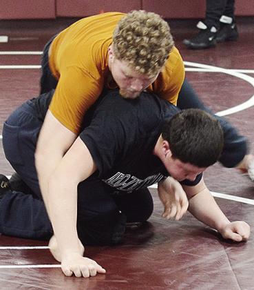 Marcus Wilson, top, takes Layne Spitz down to the mat during a preseason practice. CDN | Sam Goodwyn