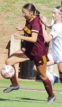Clinton’s Leila Pete outraces the Newcastle Racer during the Lady Reds’ JV game in the Tornado Bowl. CDN | Sam Goodwyn