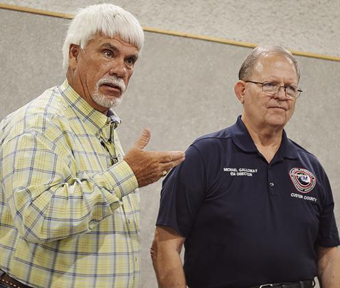 Dist. 1 Custer County Commissioner Wade Anders, left, speaks about Emergency Management Director Michael Galloway during his retirement party Friday at the Frisco Center. CDN | Micah Ashcraft