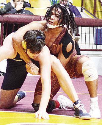 Malachi Lorne, right, wraps his opponent up during the Hub City Tournament Friday. CDN | Sam Goodwyn