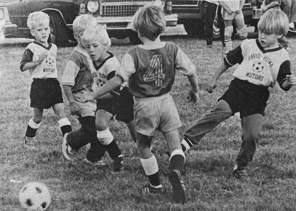 40 YEARS AGO Cutting between opponents Rodney Poeling and Hank Dye of the Bandits, Jeremy Lamar of the Kickers, went after the ball in an Under-8 soccer game played in Clinton. Also pictured were Matthew Girard, left, and Luke Brenden also members of the