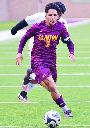 Clinton’s Carlos De La Fuente beats a Douglass defender to the ball during the Red Tornadoes win over the Trojans at home. CDN | Sam Goodwyn