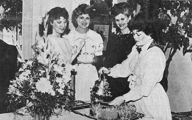 40 YEARS AGO American Cancer Society volunteers picked up their fund-drive packets at a tea hosted by Vickie Meacham. Meacham poured tea for volunteer workers from left, Janice Damron, Linda Meacham and Carol Paden.
