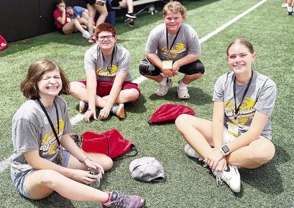 Members of Clinton’s Special Olympics team are all smiles while they hang out waiting for their time to play bocce ball during the Special Olympics Summer Games in Stillwater. Pictured, from left, are Raylei Harrel, Kenneth Williams, SJ Adkinson and Lil