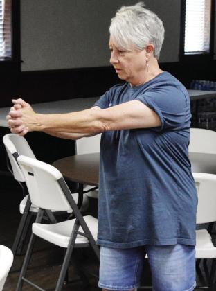 Janice Berrong instructs a strength and balance training exercise Thursday for the “Snap, Crackle, and Pop” women’s group at the First Baptist Church in Clinton. CDN | Christian Jacobsen