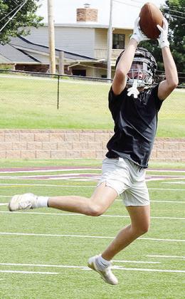 Dyson Moss jumps to snag the ball during a drill in practice at the Tornado Bowl. CDN | Sam Goodwyn