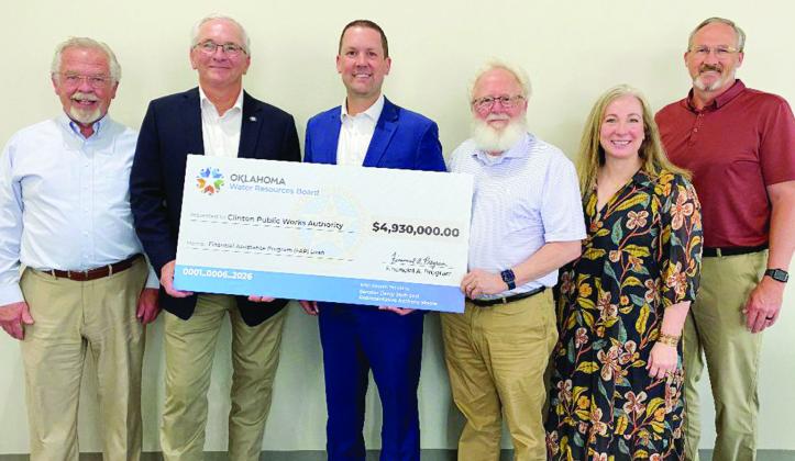 Getting everyone together to gather for a photo to commemorate the Financial Assistance Program loan from the Oklahoma Water Resources Board was the objective at the end of Friday’s Legislative Luncheon at the Frisco Center. From left are Mayor David Be