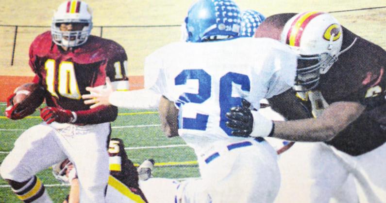 Clinton running back Willie Ford, No. 10, follows a block by teammate Ryan Hall. CDN | File Photo