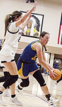 Arapaho-Butler’s Kelsey Garibay drives by a Cheyenne-Reydon defender during the girls’ championship game Saturday of the Western Equipment Classic. CDN | Sam Goodwyn