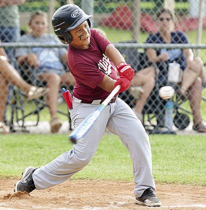 Kai Jefferson swings mightly at the ball during Clinton’s first-round game Thursday against the Altus Dawgs in the OK Kids 8U State Baseball Tournament at Schumacher Fields at Acme Brick Park. CDN | Sam Goodwyn