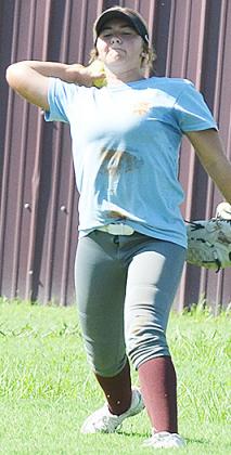 Laney Anderson focuses all her strength as she throws to first base during practice at the softball field. CDN | Sam Goodwyn