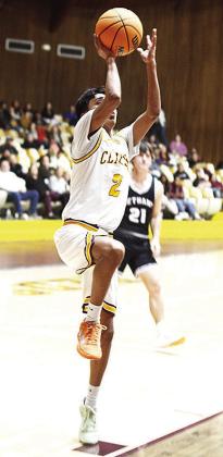 No. 2 Ronnie Redshin steps into the air for the layup Tuesday during the Reds’ home game against Bethany. CDN | Sam Goodwyn