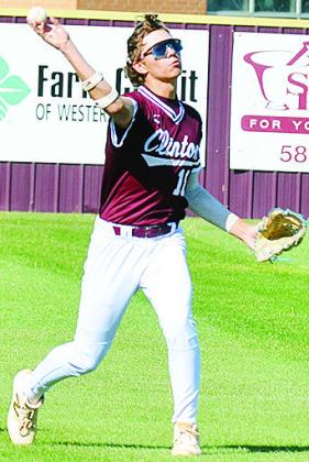 Clinton’s Ben Daugherty hurls the ball back into the infield during the Reds’ Senior- Day game Monday against Kingfisher. CDN | Sam Goodwyn