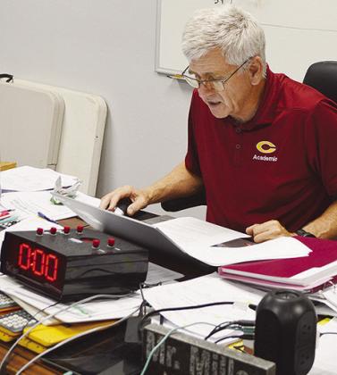 Clinton High School academic team coach Wes Miller reads off a question during a team practice in his classroom. CDN | Micah Ashcraft