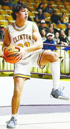 No. 23 Easten Powell scans for an open teammate during the Reds home playoff game Saturday against Kingfisher. CDN | Sam Goodwyn