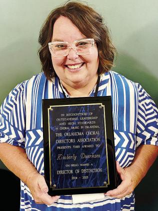 Clinton Middle and High School Choir Director Kimberly Duerksen with the award for the OkCDA 2025 Director of Distinction. CDN | Courtesy photo