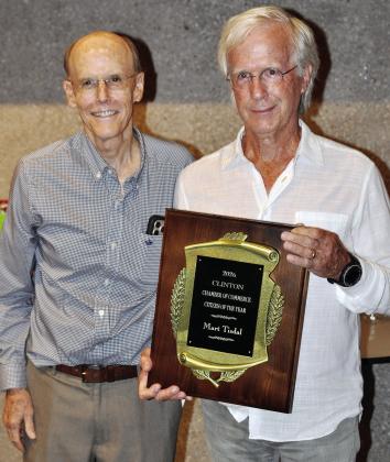 Mart Tisdal, right, is presented the 2026 Clinton Citizen of the Year award by last year’s recipient, Ken Baker. CDN | Sean Stephens