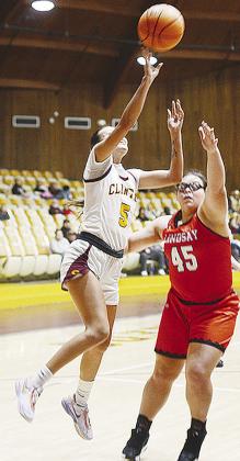 Clinton’s Lillian Lime lays the ball up to the basket over a Lindsay opponent during the Lady Reds’ home opener Saturday against the Leopardettes. CDN | Sam Goodwyn