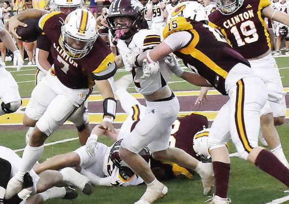 Clinton’s No. 15 Gavin Evans, right, blocks for No. 7 Easten Powell, as he carries the ball against Blanchard Friday in the Red Tornadoes’ home-opening win. CDN | John Kinsey