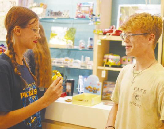 Tonkawa High School band members Dacey Fairless, left, and Galen Daykin check out some of the memorabilia available at the Oklahoma Route 66 Museum during a group trip. CDN | Micah Ashcraft