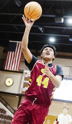 Freshman Julian Calixto drives to the basket for the layup during Clinton’s JV game on the road at Elk City. CDN |Sam Goodwyn