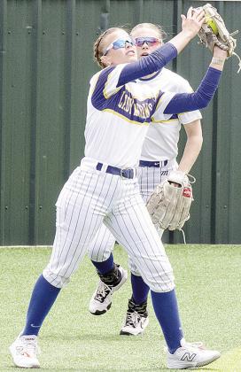 Arapaho-Butler’s Kylin Oakes, front, catches the ball for the out in front of her teammate Dalaynie Lee during the Class 3A Slow-Pitch State Championship at Firelake Ballfields in Shawnee. CDN | Sam Goodwyn