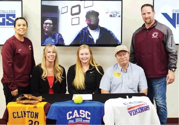Whitney signs at Carl Albert State
