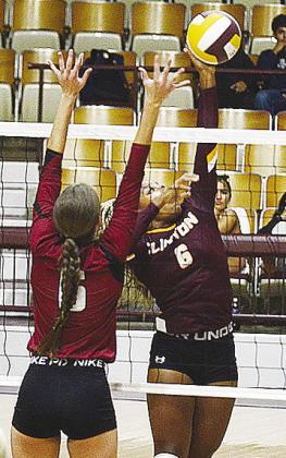 Clinton’s Arlena Kirkendoll hits the ball back over the net during the Lady Reds’ match against Weatherford Tuesday in the Dome. CDN | Sam Goodwyn