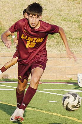No. 18 Sergio Solis charges after the ball during Clinton’s home game Monday against Harding Charter. CDN | Sam Goodwyn