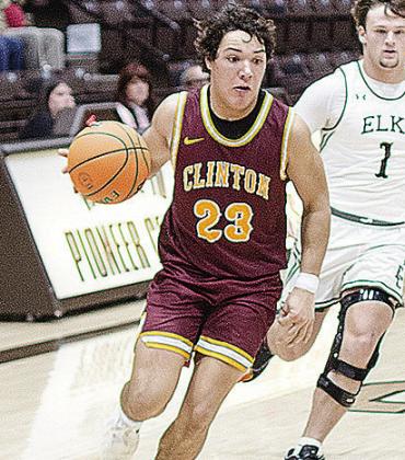 Clinton’s Easten Powell takes the ball up the court during the Reds’ road game against Elk City. CDN | Sam Goodwyn